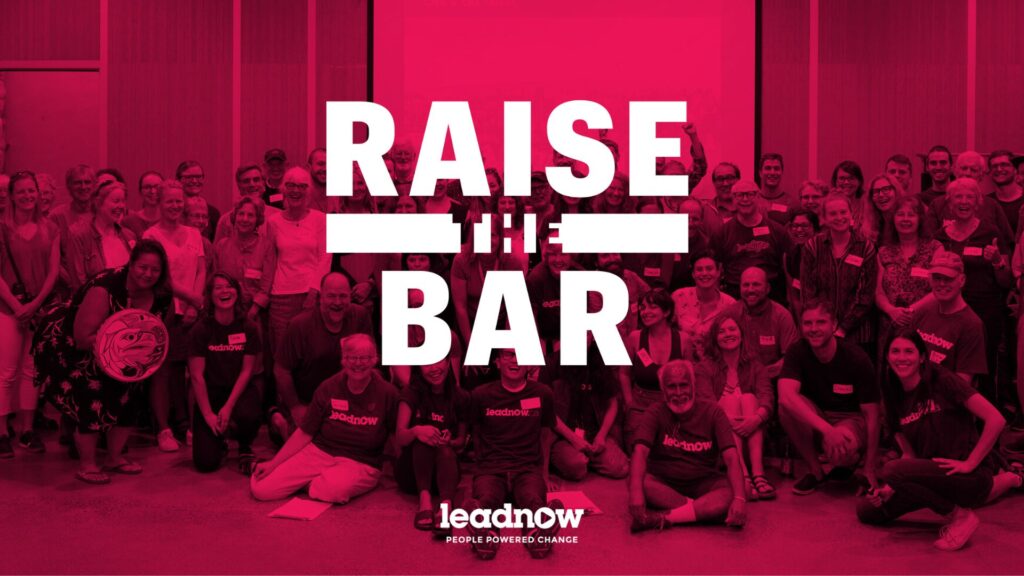 Dozens of volunteers stand shoulder to shoulder for a photo. The Raise the Bar logo is over the photo.